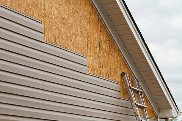 Professional Storm Damage Siding Repair technician working in Syosset, NY